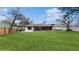 Large backyard with lush lawn at 21668 Sw Peach Blossom St, Dunnellon, FL 34431