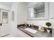 Clean bathroom with single sink vanity and door to outside at 21668 Sw Peach Blossom St, Dunnellon, FL 34431