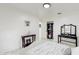 White bedroom with a queen bed and walk-in closet at 21668 Sw Peach Blossom St, Dunnellon, FL 34431