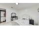 Bedroom with a queen bed, dresser, and closet at 21668 Sw Peach Blossom St, Dunnellon, FL 34431