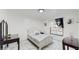 Charming bedroom with white bed frame and marble floors at 21668 Sw Peach Blossom St, Dunnellon, FL 34431