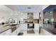 Modern kitchen with stainless steel appliances and a large island at 21668 Sw Peach Blossom St, Dunnellon, FL 34431