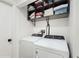 Laundry room with washer, dryer, and shelving at 21668 Sw Peach Blossom St, Dunnellon, FL 34431