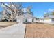 Newly built home with gray siding, stone accents, and a modern design at 218 Nw 9Th Ave, Ocala, FL 34475