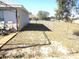 Backyard with wooden deck and chain link fence at 221 Locust Ln, Ocala, FL 34472