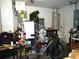 Overstuffed garage with bicycle and workbench at 221 Locust Ln, Ocala, FL 34472