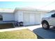 Attached garage with double doors and driveway at 221 Locust Ln, Ocala, FL 34472