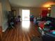 Living room with laminate floors and sliding glass doors at 221 Locust Ln, Ocala, FL 34472