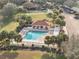 Resort-style community pool with surrounding lounge area at 3324 Oakdale Pl, The Villages, FL 32162