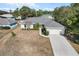 Aerial view of single Gathering home with driveway and yard at 3953 Sw 133Rd Loop, Ocala, FL 34473