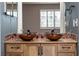 Double vanity with copper sinks and tile backsplash at 4343 Nw 80Th Ave # 4, Ocala, FL 34482