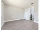 Spacious bedroom with grey laminate flooring and closet at 4343 Nw 80Th Ave # 4, Ocala, FL 34482