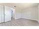 Bright bedroom with grey laminate flooring and closet at 4343 Nw 80Th Ave # 4, Ocala, FL 34482