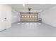 Attached garage with light grey epoxy floor and overhead door at 4343 Nw 80Th Ave # 4, Ocala, FL 34482