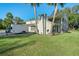 Two-story house with carport, palm trees, and grassy yard at 4343 Nw 80Th Ave # 4, Ocala, FL 34482