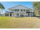 Two-story house with columns, brick facade, and well-maintained lawn at 4343 Nw 80Th Ave # 4, Ocala, FL 34482