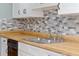 Modern kitchen sink with butcher block countertop at 4343 Nw 80Th Ave # 4, Ocala, FL 34482