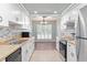 Updated kitchen with stainless steel appliances and wood-look floors at 4343 Nw 80Th Ave # 4, Ocala, FL 34482
