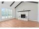 Living room with a stone fireplace and hardwood floors at 4343 Nw 80Th Ave # 4, Ocala, FL 34482