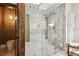 Elegant bathroom featuring a glass-enclosed shower with marble tile and a separate toilet room at 4400 Sw 20Th Ave, Ocala, FL 34471
