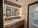 Contemporary bathroom with dual sinks, a backlit mirror, and modern fixtures at 4400 Sw 20Th Ave, Ocala, FL 34471