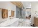 Modern bathroom with a soaking tub, glass shower, marble floors, and stylish fixtures at 4400 Sw 20Th Ave, Ocala, FL 34471