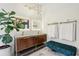 Elegant bathroom featuring a double vanity, decorative mirrors, and modern lighting fixtures at 4400 Sw 20Th Ave, Ocala, FL 34471