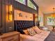 Bright bedroom with high ceilings, custom lighting, and modern decor creating a cozy atmosphere at 4400 Sw 20Th Ave, Ocala, FL 34471