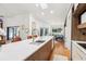 Kitchen with a large island, white countertops, hardwood floors and stainless steel appliances at 4400 Sw 20Th Ave, Ocala, FL 34471