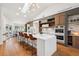 Modern kitchen island featuring bar seating, white countertops, and a contemporary design at 4400 Sw 20Th Ave, Ocala, FL 34471