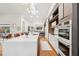 Bright kitchen with a large island, built in oven and white countertops at 4400 Sw 20Th Ave, Ocala, FL 34471