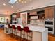 Modern kitchen features custom cabinetry, quartz countertops and stainless steel appliances at 4400 Sw 20Th Ave, Ocala, FL 34471