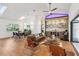 Open-concept living room featuring a stylish bar area, opening to an outdoor living space at 4400 Sw 20Th Ave, Ocala, FL 34471