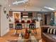 Open concept living space with modern lighting, hardwood floors and a sleek, modern design at 4400 Sw 20Th Ave, Ocala, FL 34471