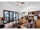 Open living room with modern furnishings, a fireplace view of the patio at 4400 Sw 20Th Ave, Ocala, FL 34471