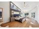 Spacious primary bedroom boasting hardwood floors, a large window, and natural light at 4400 Sw 20Th Ave, Ocala, FL 34471