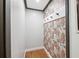 Functional mud room with floral wallpaper, hooks, and ample storage at 4400 Sw 20Th Ave, Ocala, FL 34471