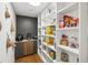 Well-organized pantry with ample shelving and a variety of food items at 4400 Sw 20Th Ave, Ocala, FL 34471
