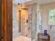 Bathroom featuring a luxurious walk-in shower with marble tile and modern fixtures at 4400 Sw 20Th Ave, Ocala, FL 34471