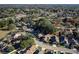 Aerial view of a residential area with tree-lined streets and neatly arranged homes with spacious yards at 4542 Ne 4Th St, Ocala, FL 34470