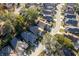 Aerial view showing a residential area with tree-lined streets, well-maintained homes, and spacious yards at 4542 Ne 4Th St, Ocala, FL 34470