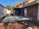 This backyard features a screened in patio, mulch flower bed, and walking stones at 4542 Ne 4Th St, Ocala, FL 34470