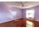 Bedroom with a window and hardwood floors at 4542 Ne 4Th St, Ocala, FL 34470