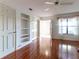 Bright bedroom featuring wood floors and a ceiling fan at 4542 Ne 4Th St, Ocala, FL 34470