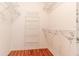 Spacious closet with wire shelving and hanging rods at 4542 Ne 4Th St, Ocala, FL 34470