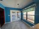 Bright dining area featuring a large window, tile floors, and direct access to the patio through double doors at 4542 Ne 4Th St, Ocala, FL 34470