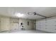 Spacious garage with epoxy flooring, storage shelves and cabinets, and a utility sink at 4542 Ne 4Th St, Ocala, FL 34470