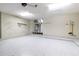 Clean garage featuring epoxy flooring, ample storage shelving, and easy access to home systems at 4542 Ne 4Th St, Ocala, FL 34470