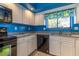 Kitchen with black appliances, granite countertops, and white cabinets at 4542 Ne 4Th St, Ocala, FL 34470