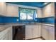 Kitchen boasts granite countertops and white cabinets at 4542 Ne 4Th St, Ocala, FL 34470